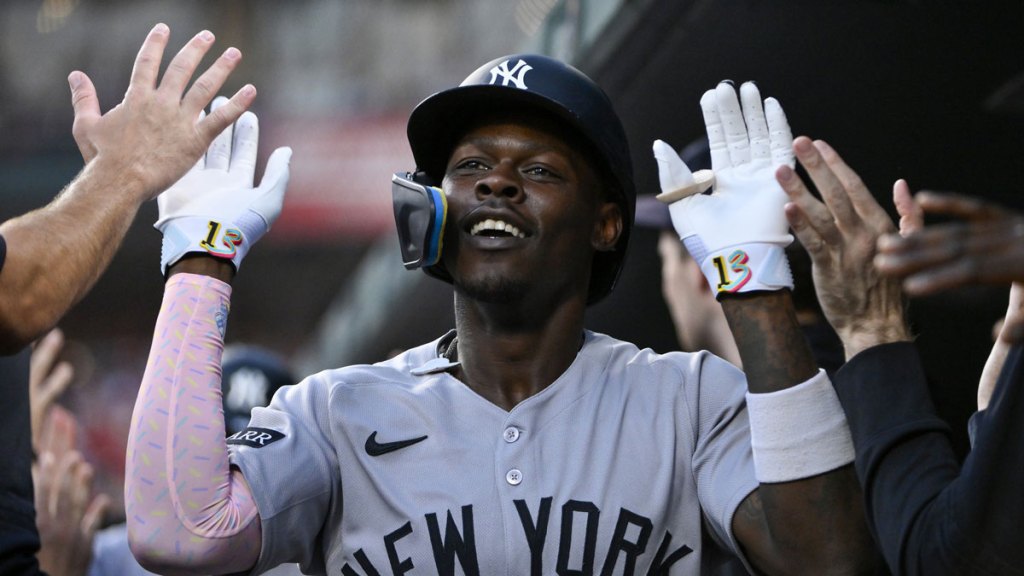 New York Yankees second baseman Jazz Chisholm Jr. (13) is congratulated by teammates after hitting a two run home run against the St. Louis Cardinals during the first inning at Busch Stadium.