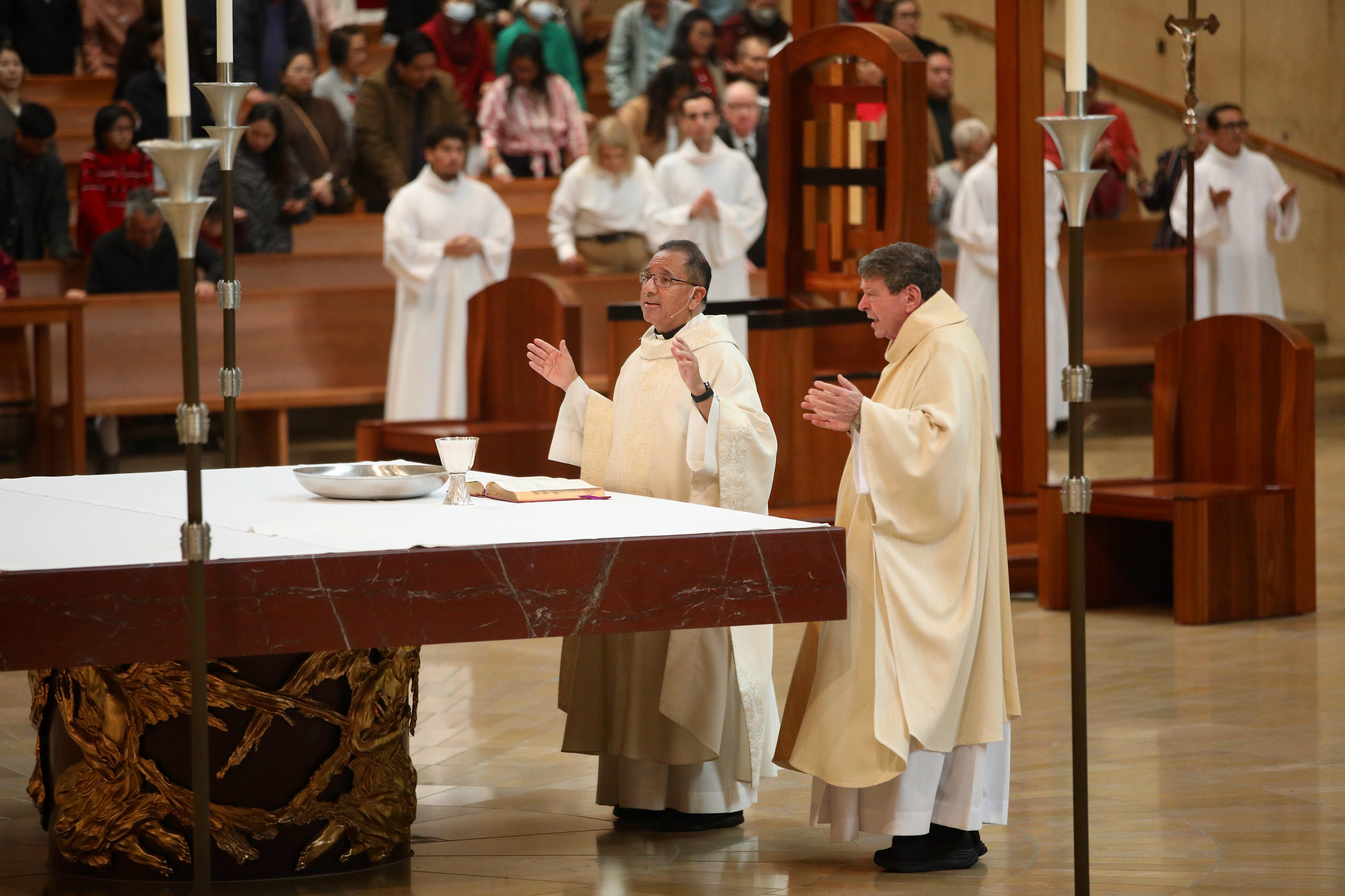 The Rev. David Gallardo presides over Christmas Day Mass at...