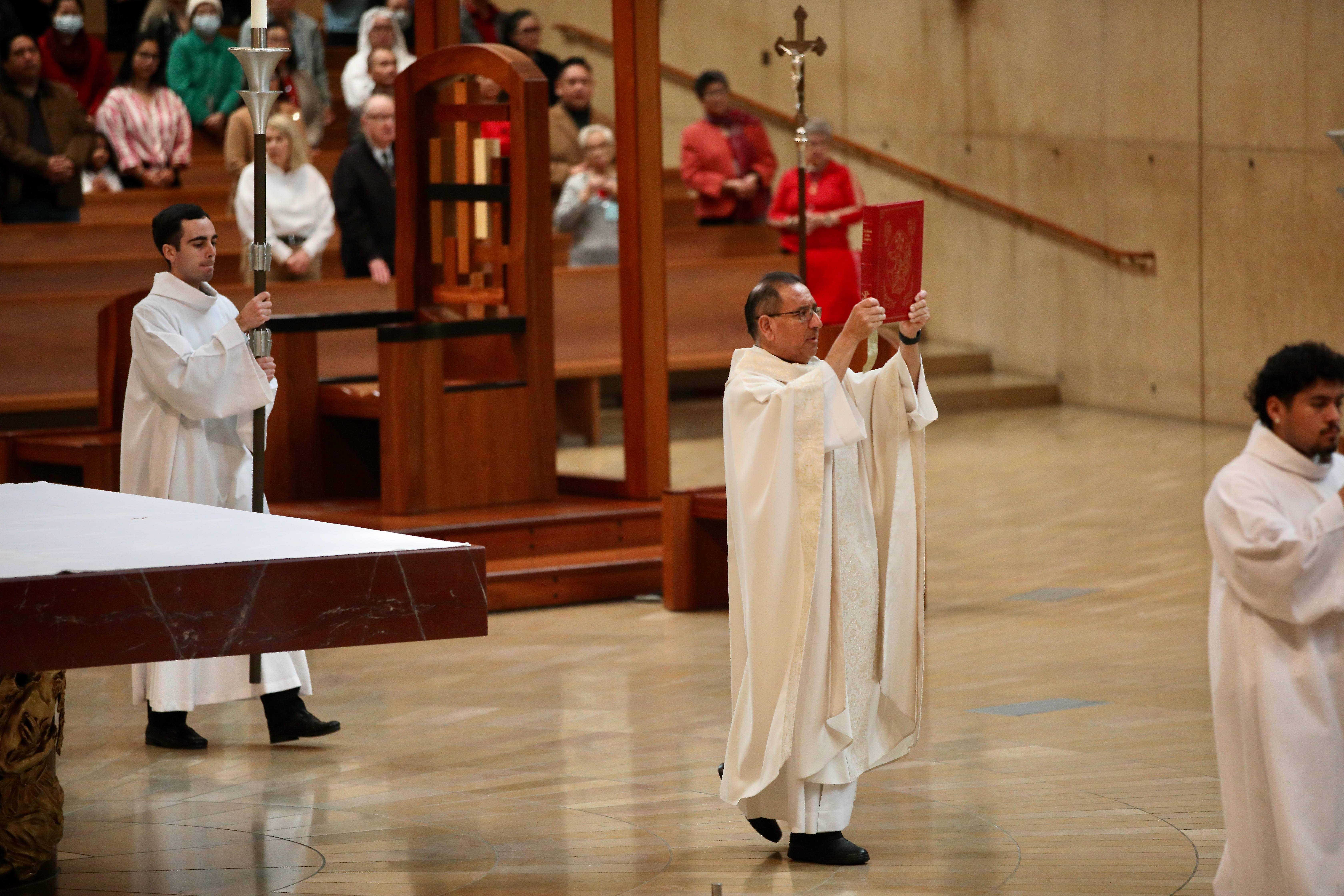 The Rev. David Gallardo presides over Christmas Day Mass at...