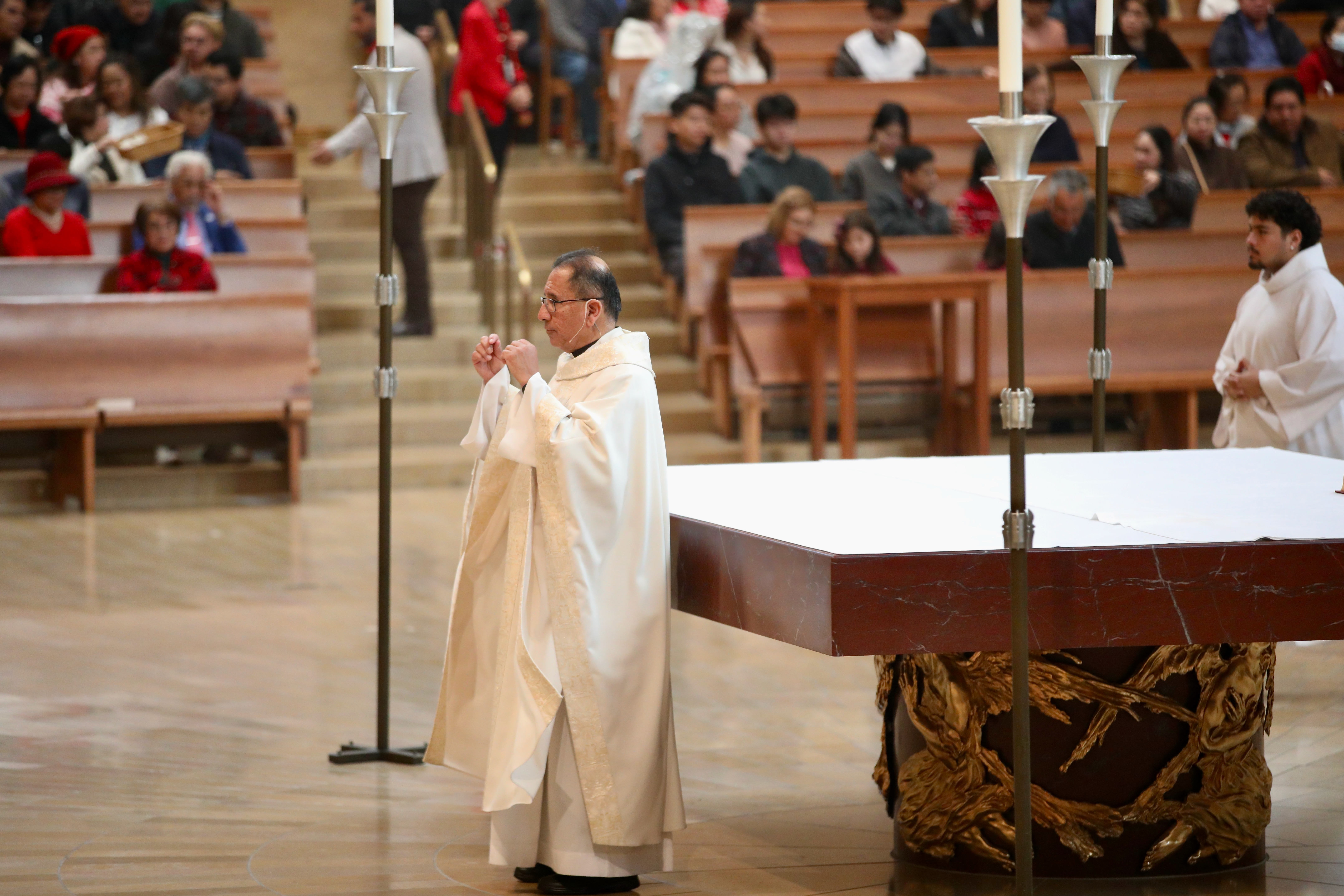 The Rev. David Gallardo presides over Christmas Day Mass at...
