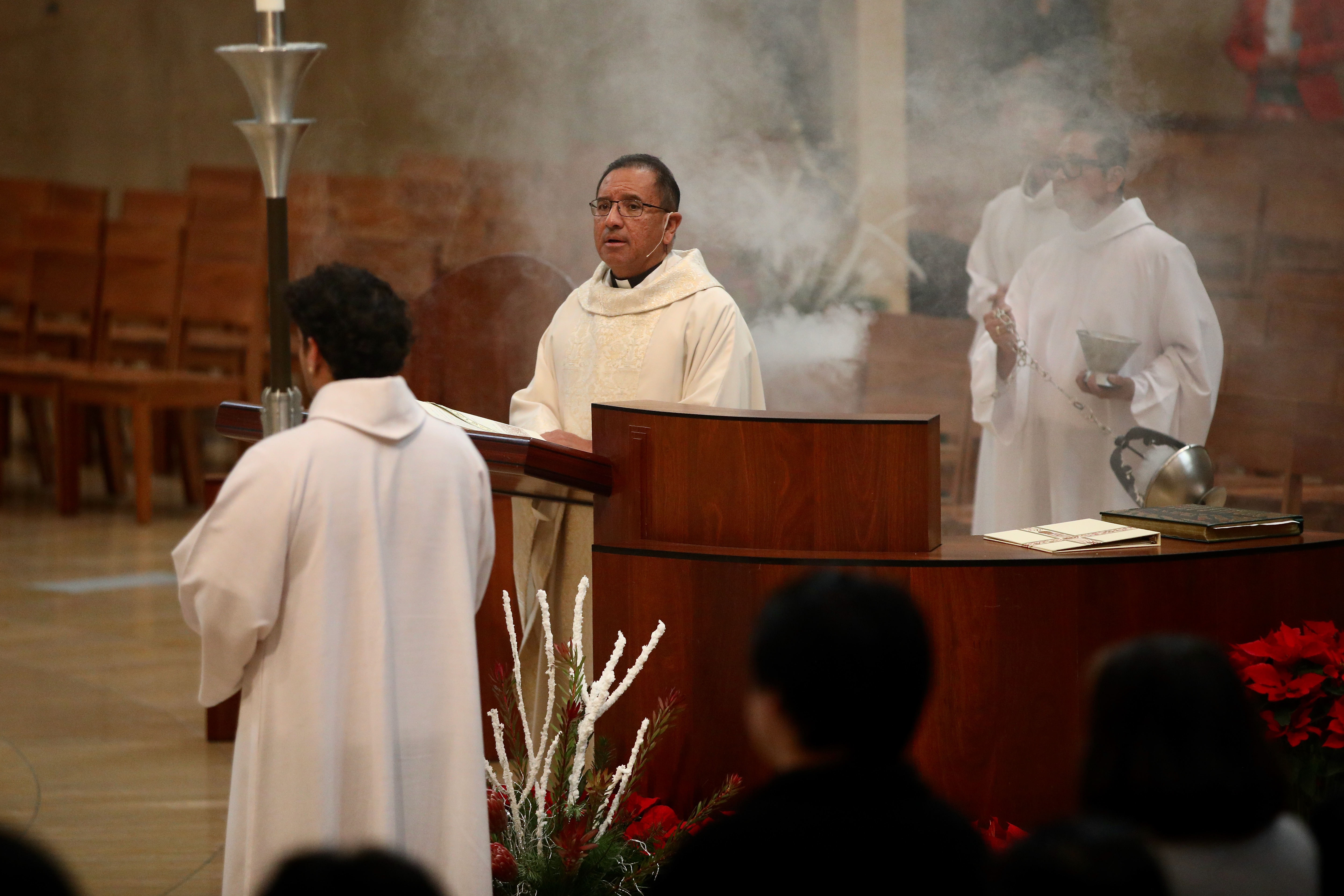 The Rev. David Gallardo leads Christmas Day Mass at the...