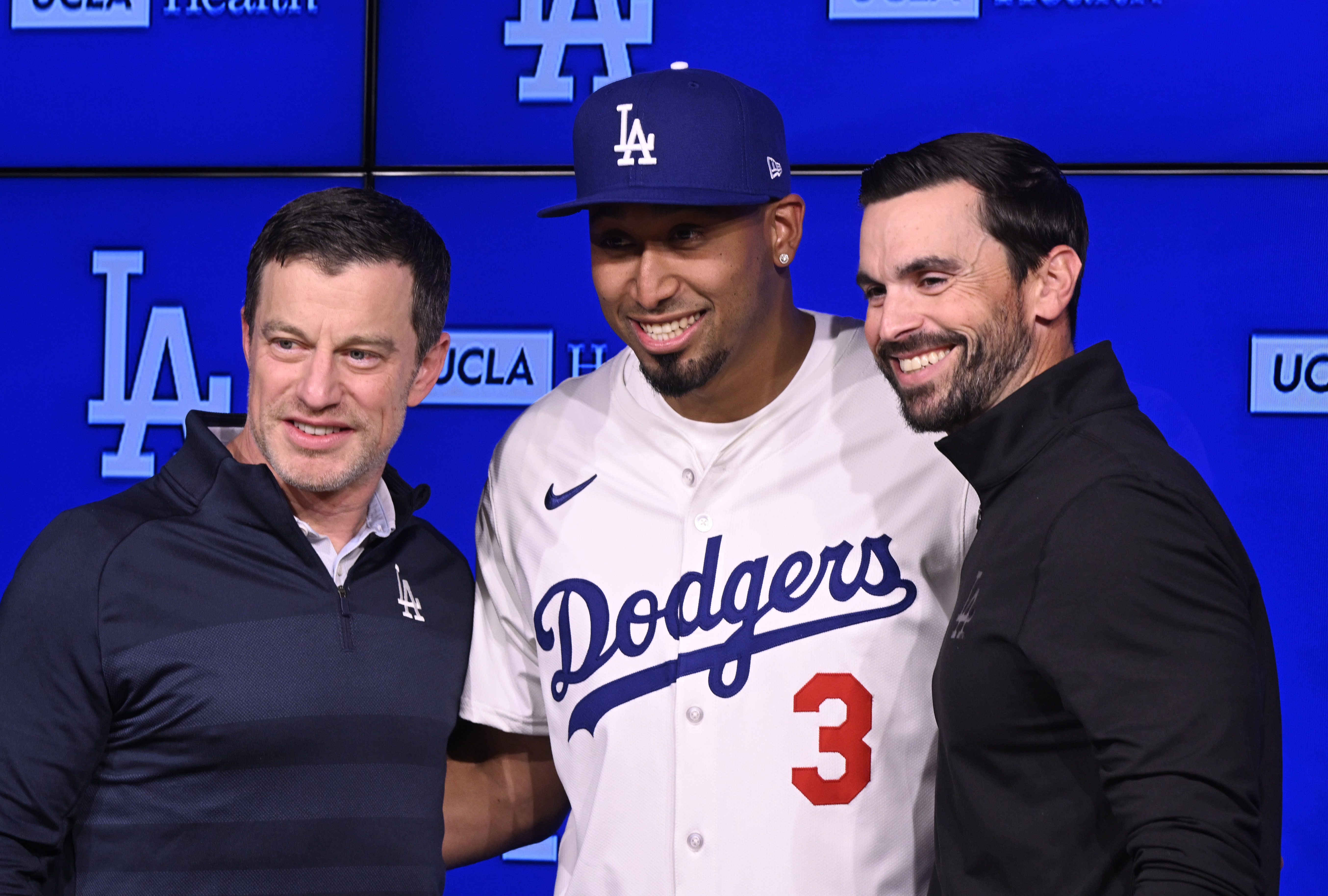 Newly signed Dodgers relief pitcher Edwin Diaz poses for photos...