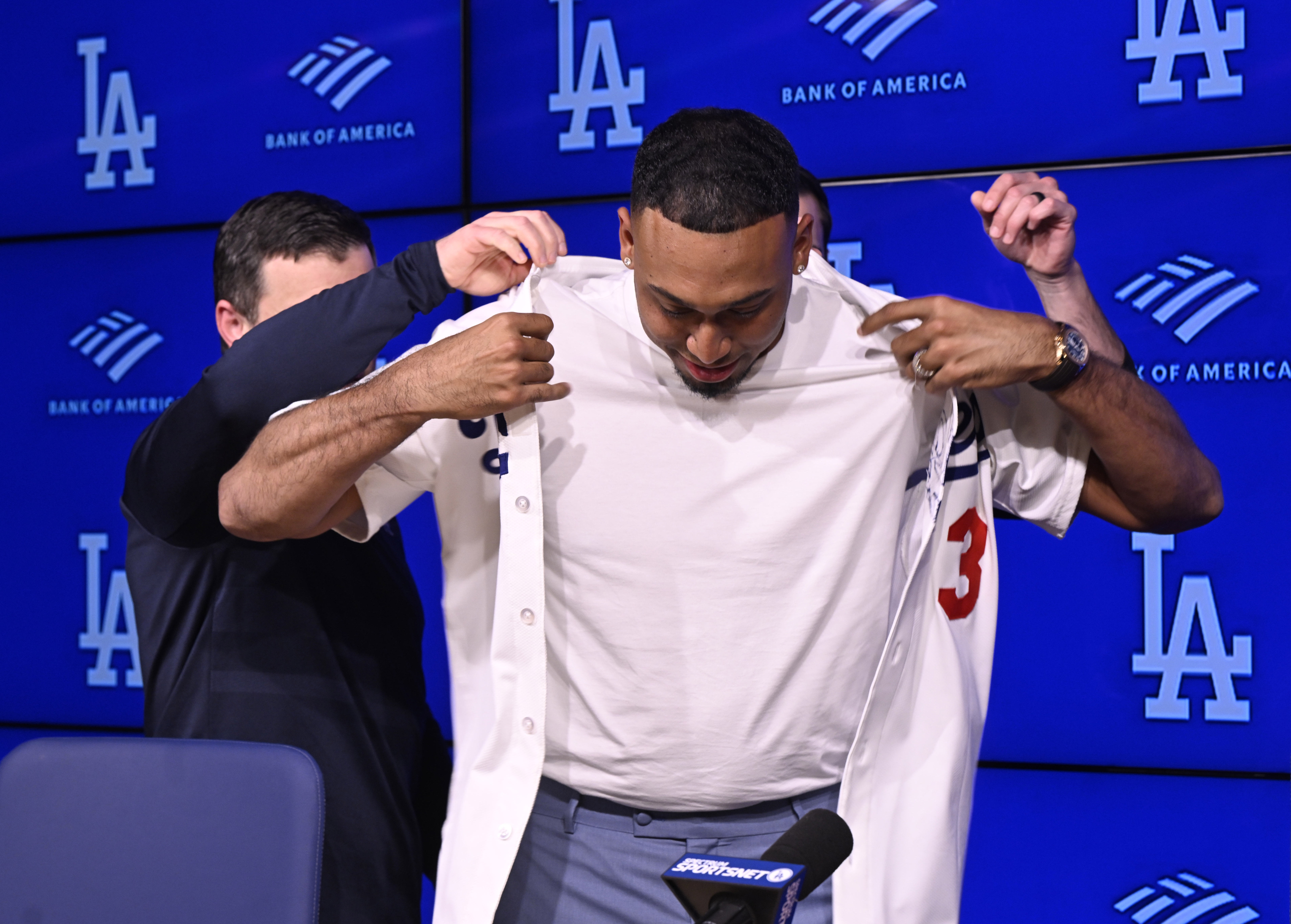 Newly signed Dodgers relief pitcher Edwin Diaz tries on his...