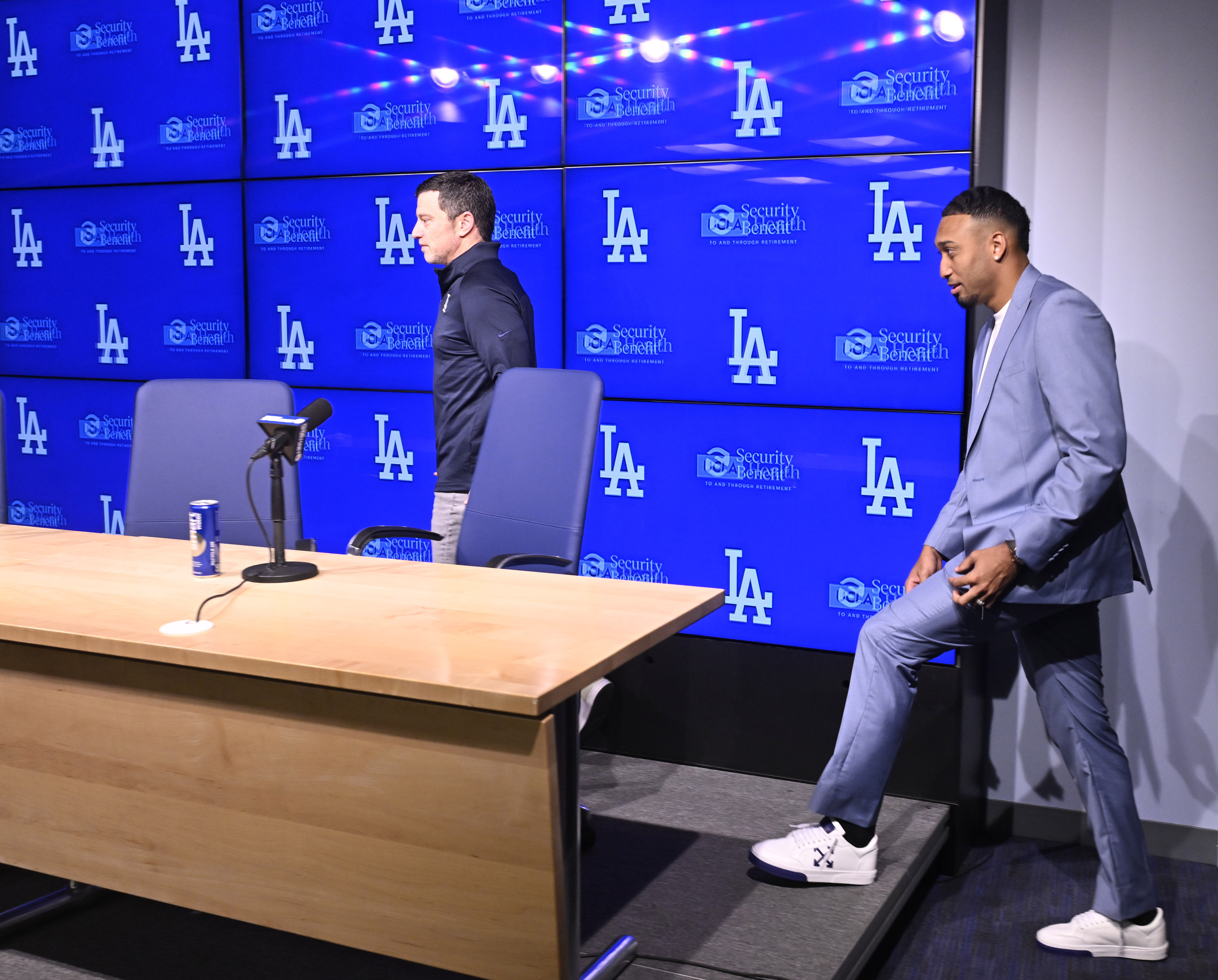 Newly signed Dodgers relief pitcher Edwin Diaz, right, arrives for...