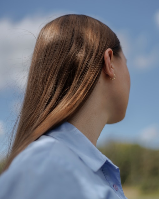 Alex, a 27-year-old Ukrainian immigrant, poses for a portrait in Riverdale, Md., on Friday, September 26, 2025. The University of Maryland, College Park, agreed to sponsor her H-1B visa to continue her research on global hunger. But this week the Trump administration’s new immigration policy sent her fortunes into reverse.
