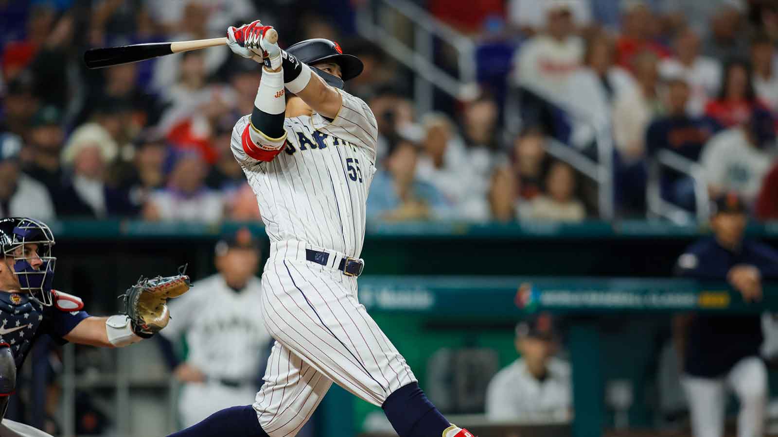 Japan third baseman Munetaka Murakami (55) hits a home run during the second inning against USA at LoanDepot Park. 