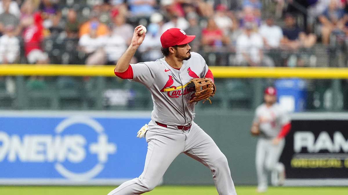 St. Louis Cardinals third baseman Nolan Arenado (28) fields the ball in the first inning against the Colorado Rockies at Coors Field.
