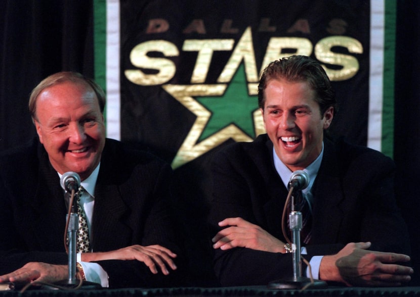 Dallas Stars' owner Tom Hicks (left) and Mike Modano share a laugh during a press conference...