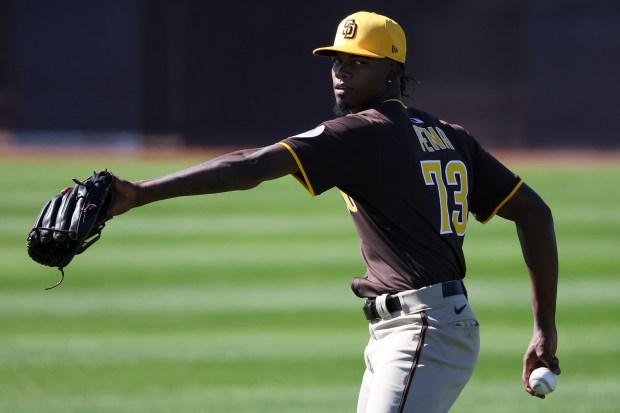 Francis Pena throws during Padres spring training workouts at the Peoria Sports Complex on Saturday, Feb. 15, 2025 in Peoria, Ariz.. (Meg McLaughlin / The San Diego Union-Tribune)