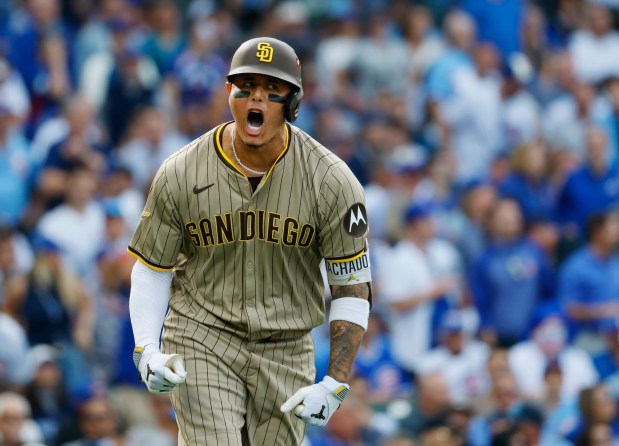 Manny Machado #13 of the San Diego Padres celebrates after hitting a two-run home run in the fifth inning against the Chicago Cubs during Game 2 of the NL Wild Card Series at Wrigley Field on Oct. 1, 2025 in Chicago, Illinois. (Photo by K.C. Alfred / The San Diego Union-Tribune)