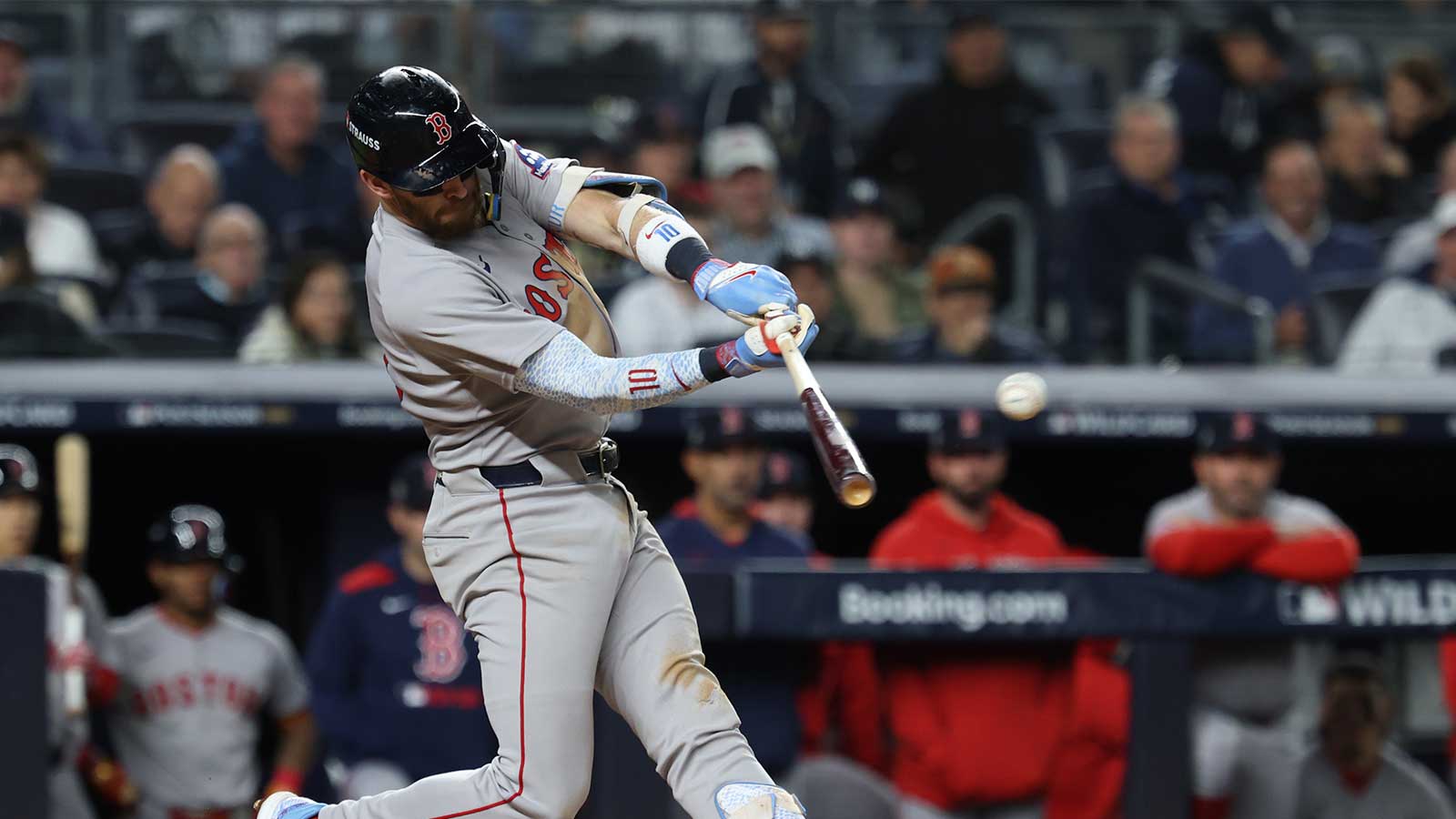 Boston Red Sox shortstop Trevor Story (10) hits a two run single during the third inning against the New York Yankees during game two of the Wildcard round for the 2025 MLB playoffs at Yankee Stadium.