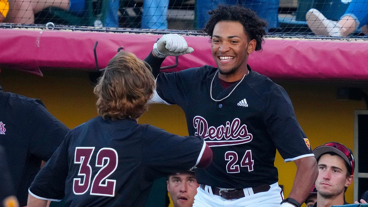 Luke Keaschall (32) and Isaiah Jackson (24) of Arizona State University celebrate after a Keaschall home run during a game at Phoenix Municipal Stadium on May 6, 2023. (Syndication: Arizona Republic)