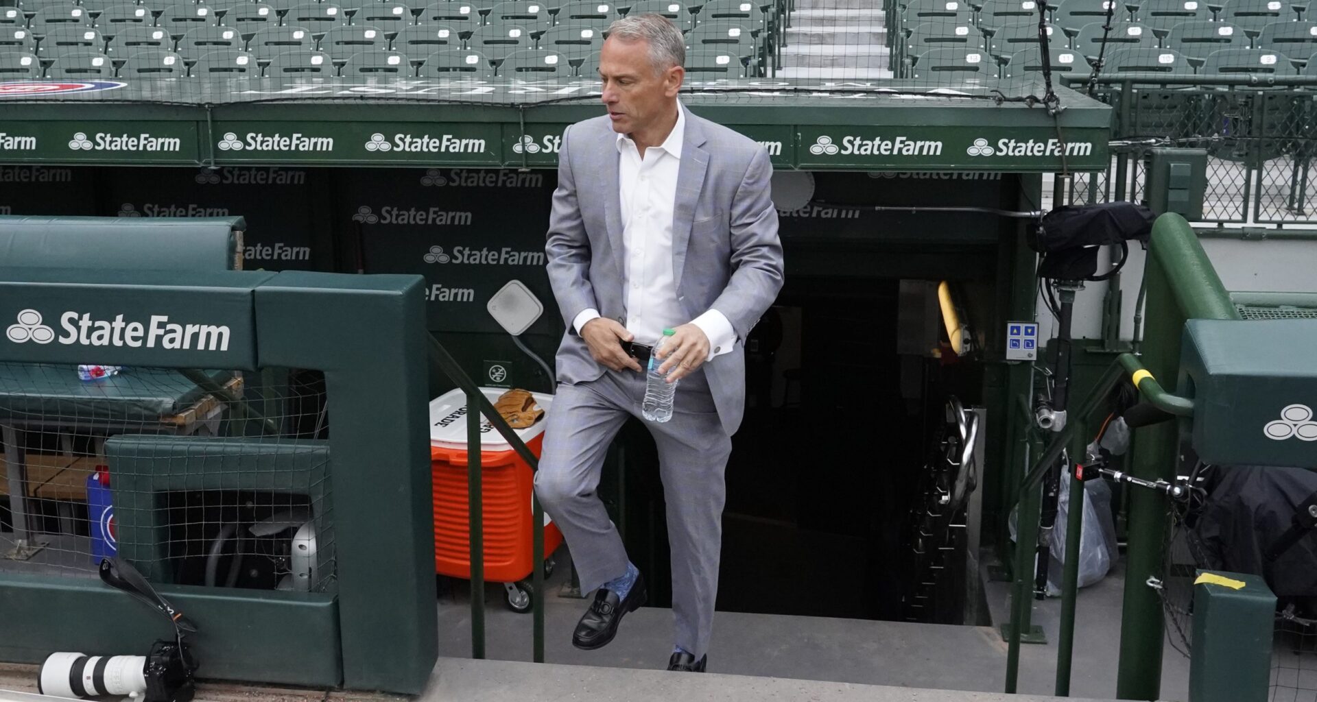 Jed Hoyer President of the Chicago Cubs walks onto the field before a game