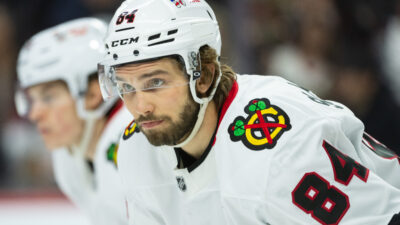 Apr 15, 2025; Ottawa, Ontario, CAN; Chicago Blackhawks left wing Landon Slaggert (84) gets in position for a faceoff in the first period against the Ottawa Senators at the Canadian Tire Centre. Mandatory Credit: Marc DesRosiers-Imagn Images