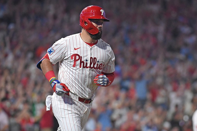 Aug 4, 2025; Philadelphia, Pennsylvania, USA; Philadelphia Phillies outfielder Kyle Schwarber (12) watches his grand slam home run during the sixth inning against the Baltimore Orioles at Citizens Bank Park. Mandatory Credit: Eric Hartline-Imagn Images