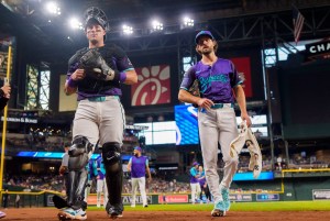 Aug 8, 2025; Phoenix, Arizona, USA; Arizona Diamondbacks pitcher Zac Gallen (23) and catcher James McCann (8) prepare to take the mound for the start of a game against the Colorado Rockies at Chase Field. Mandatory Credit: Allan Henry-Imagn Images