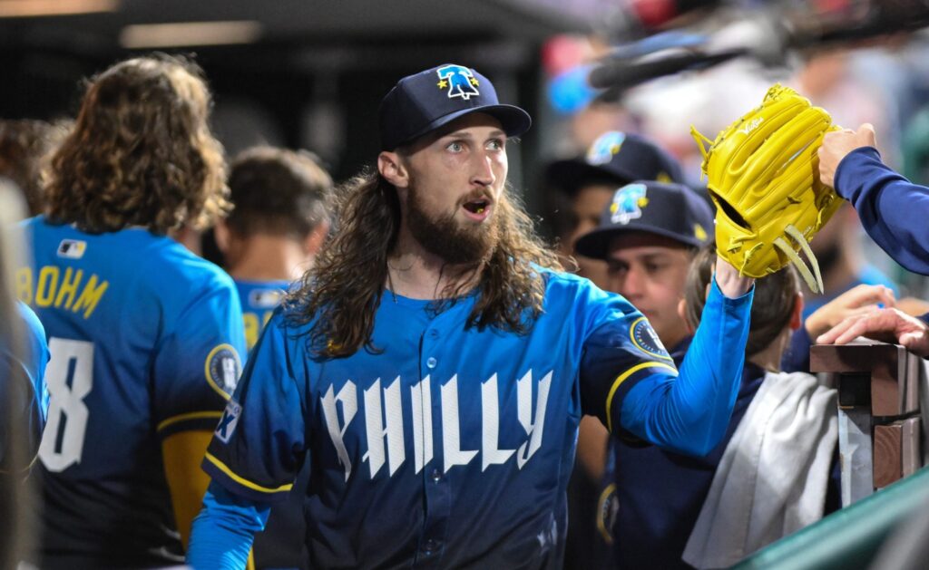 Aug 22, 2025; Philadelphia, Pennsylvania, USA; Philadelphia Phillies pitcher Matt Strahm (25) is greeted by teammates in the dugout after the seventh inning against the Washington Nationals at Citizens Bank Park.