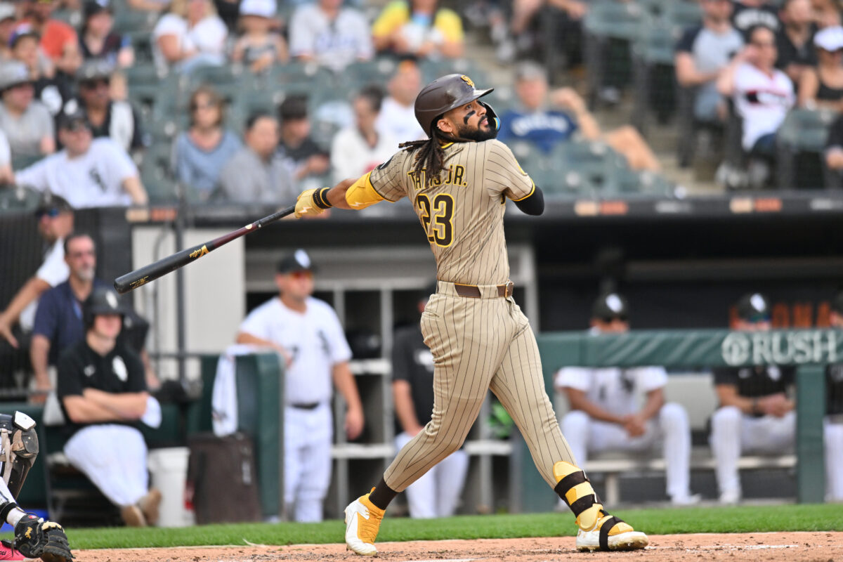Sep 21, 2025; Chicago, Illinois, USA; San Diego Padres right fielder Fernando Tatis Jr. (23) hits a single against the Chicago White Sox during the seventh inning at Rate Field. Mandatory Credit: Patrick Gorski-Imagn Images