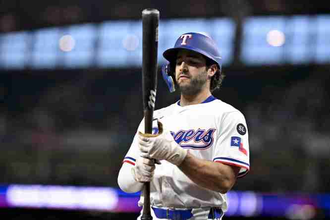 Sep 24, 2025; Arlington, Texas, USA; Texas Rangers shortstop Josh Smith (8) walks to the on deck circle during the first inning against the Minnesota Twins at Globe Life Field. Mandatory Credit: Jerome Miron-Imagn Images