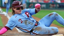 Sep 25, 2025; Philadelphia, Pennsylvania, USA; Philadelphia Phillies outfielder Harrison Bader (2) slides home for a run against the Miami Marlins during the first inning at Citizens Bank Park. Mandatory Credit: Bill Streicher-Imagn Images