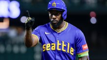 Sep 25, 2025; Seattle, Washington, USA; Seattle Mariners left fielder Randy Arozarena (56) reacts towards the dugout after hitting a two-run single against the Colorado Rockies during the fourth inning at T-Mobile Park. Mandatory Credit: Joe Nicholson-Imagn Images