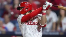 Oct 6, 2025; Philadelphia, Pennsylvania, USA; Philadelphia Phillies third baseman Alec Bohm (28) hits a single against the Los Angeles Dodgers in the ninth inning during game two of the NLDS round for the 2025 MLB playoffs at Citizens Bank Park. Mandatory Credit: Bill Streicher-Imagn Images