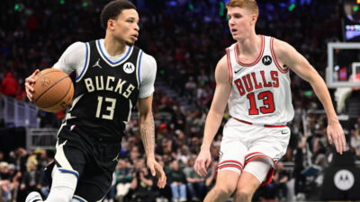 Nov 7, 2025; Milwaukee, Wisconsin, USA; Milwaukee Bucks guard Ryan Rollins (13) drives for the basket against Chicago Bulls guard Kevin Huerter (13) in the 4th quarter at Fiserv Forum.