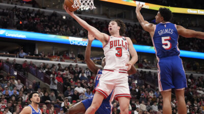 Dec 26, 2025; Chicago, Illinois, USA; Philadelphia 76ers guard Quentin Grimes (5) defends Chicago Bulls guard Josh Giddey (3) during the first half at United Center. Mandatory Credit: David Banks-Imagn Images
