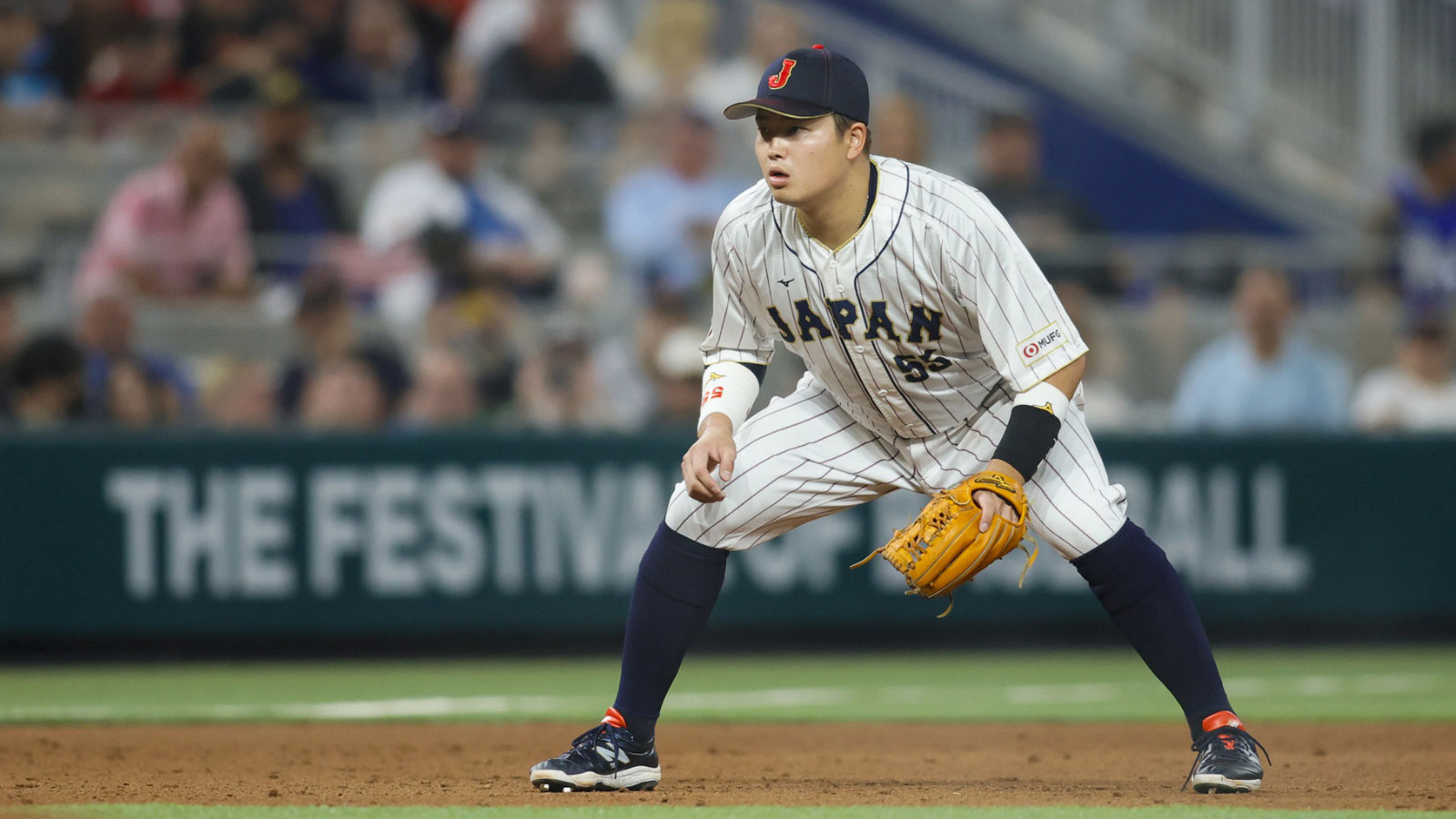 Japan third baseman Munetaka Murakami (55) plays his position during the sixth inning against the USA at LoanDepot Park.