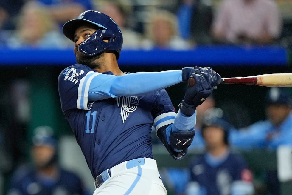 Kansas City Royals' Maikel Garcia watches his two run home home run during the third inning of...