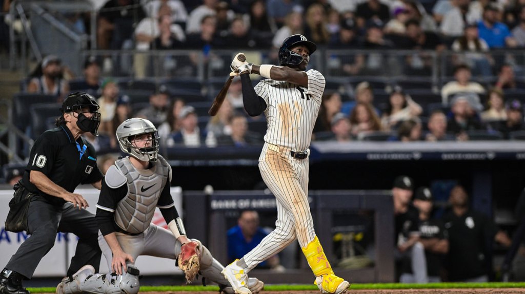 New York Yankees second baseman Jazz Chisholm Jr. (13) follows through after hitting a single against the Chicago White Sox during the eighth inning at Yankee Stadium.
