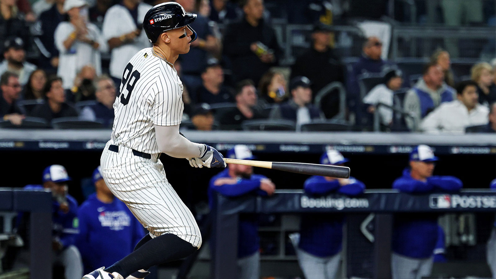 New York Yankees right fielder Aaron Judge (99) hits a single during the first inning against the Toronto Blue Jays during game four of the ALDS round for the 2025 MLB playoffs at Yankee Stadium.