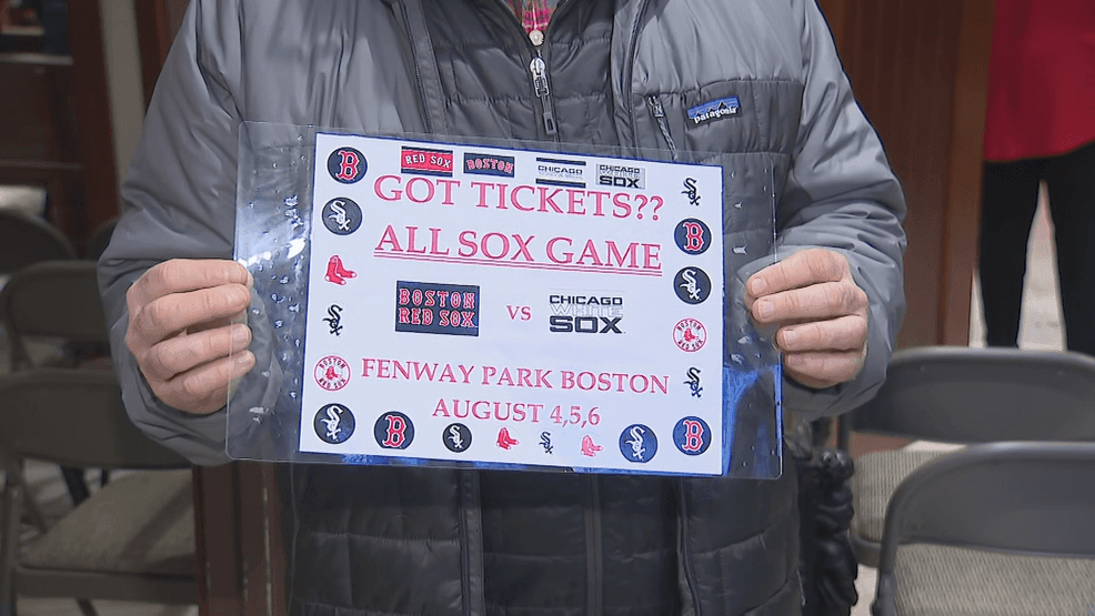 Stephen Ryan holds up a Red Sox-White Sox sign that he says caught the eye of Pope Leo XIV. (NBC Boston)