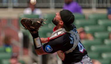 Miami Marlins catcher Ali Sánchez tracks a pop fly during a game against the Atlanta Braves on August 4, 2024, in Atlanta.
