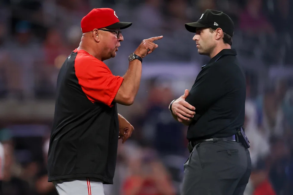 Cincinnati Reds manager Terry Francona (77) yells at umpire Alex MacKayBrett Davis-Imagn Images