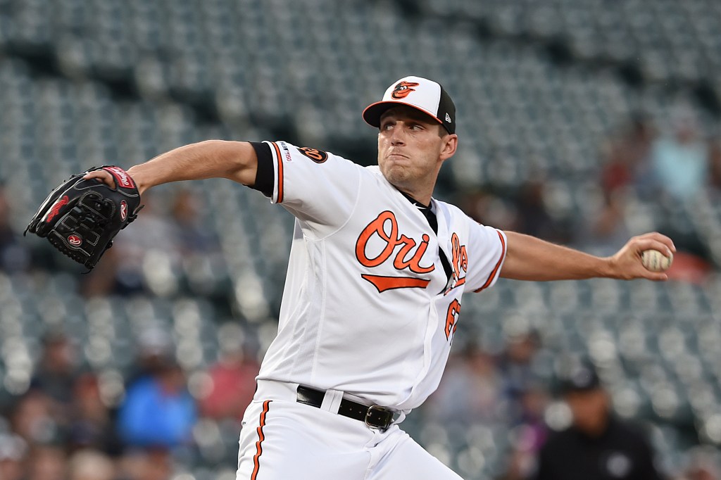 Baltimore Orioles pitcher John Means throws a baseball.