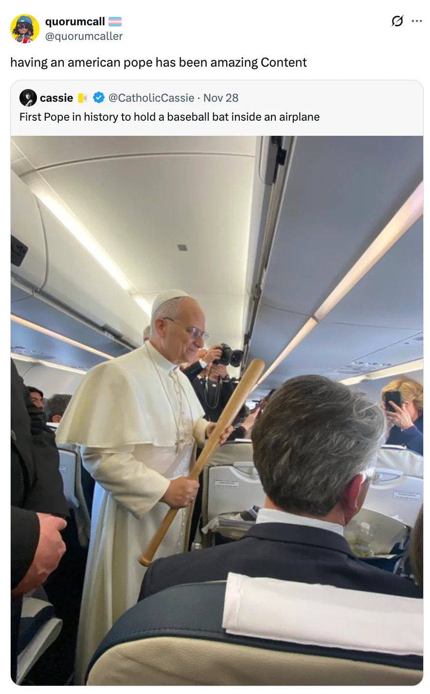 A man dressed as a Pope holds a baseball bat while standing inside an airplane, surrounded by passengers
