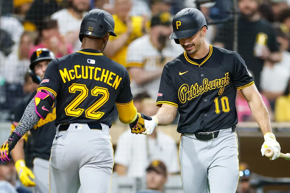 May 31, 2025; San Diego, California, USA; Pittsburgh Pirates designated hitter Andrew McCutchen (22) celebrates with Pittsburgh Pirates right fielder Bryan Reynolds (10) after hitting a one run home run during the fifth inning against the San Diego Padres at Petco Park. Mandatory Credit: David Frerker-Imagn Images
