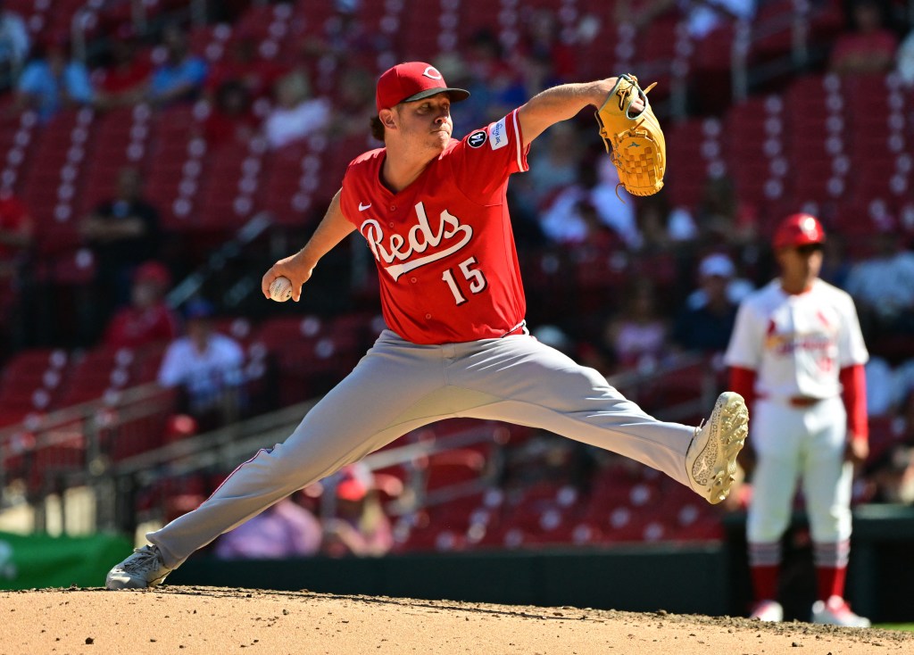 Cincinnati Reds pitcher Emilio Pagan (15) pitches in relief against the St. Louis Cardinals.