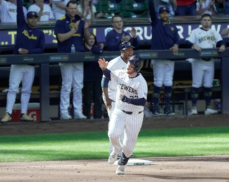 Milwaukee Brewers catcher Danny Jansen rounds first base after hitting a two-run home run against the Cincinnati Reds.