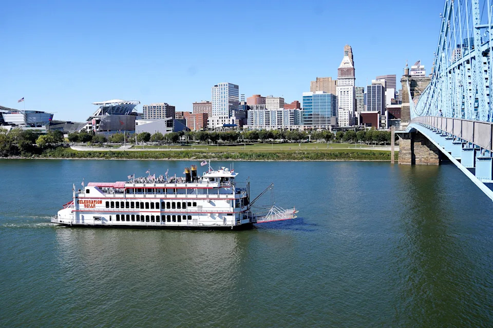 The Celebration Delle cruises down the Ohio River during the boat parade at the America’s River Roots Festival, Thursday, Oct. 9, 2025, in downtown Cincinnati.