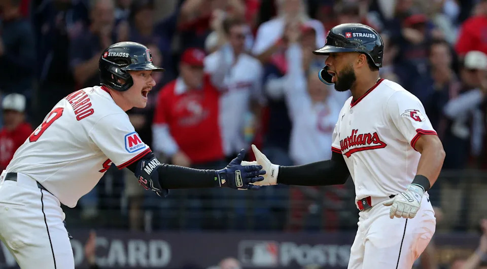 Cleveland Guardians right fielder George Valera (35) celebrates with Kyle Manzardo (9) after scoring during the fourth inning of Game 3 of the American League Wild Card Series at Progressive Field, Oct. 2, 2025, in Cleveland, Ohio.