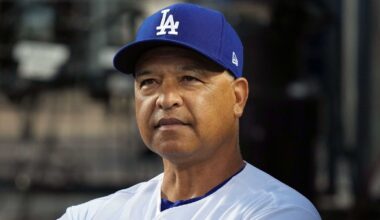 Dodgers manager Dave Roberts looking on