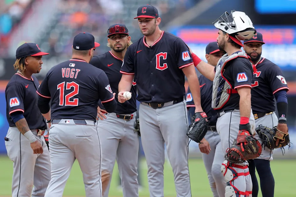 Aug 6, 2025; New York City, New York, USA; Cleveland Guardians manager Stephen Vogt (12) takes the ball from starting pitcher Gavin Williams (32) during a pitching change during the ninth inning against the New York Mets at Citi Field. Mandatory Credit: Brad Penner-Imagn Images