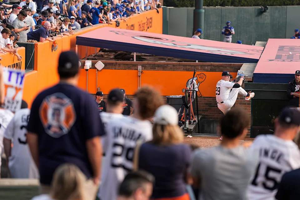 Baseball fans watch Detroit Tigers pitcher Tarik Skubal warm up in the bullpen at Comerica Park in Detroit before a start against the Chicago Cubs on Friday, June 6, 2025.