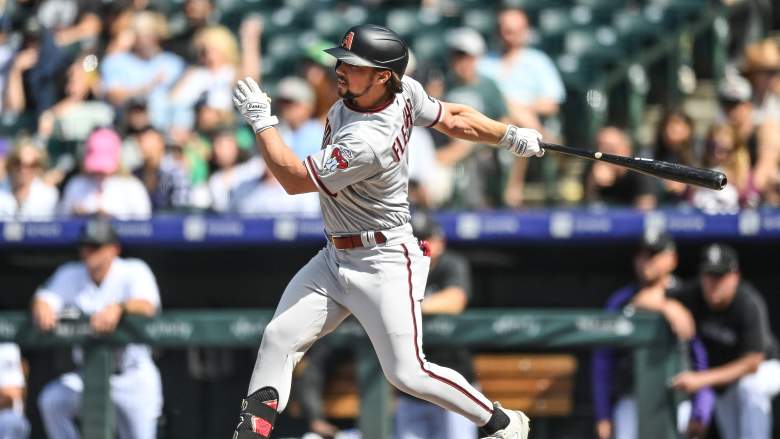 Arizona Diamondbacks outfielder Dominic Fletcher doubles in his MLB debut against the Colorado Rockies at Coors Field.