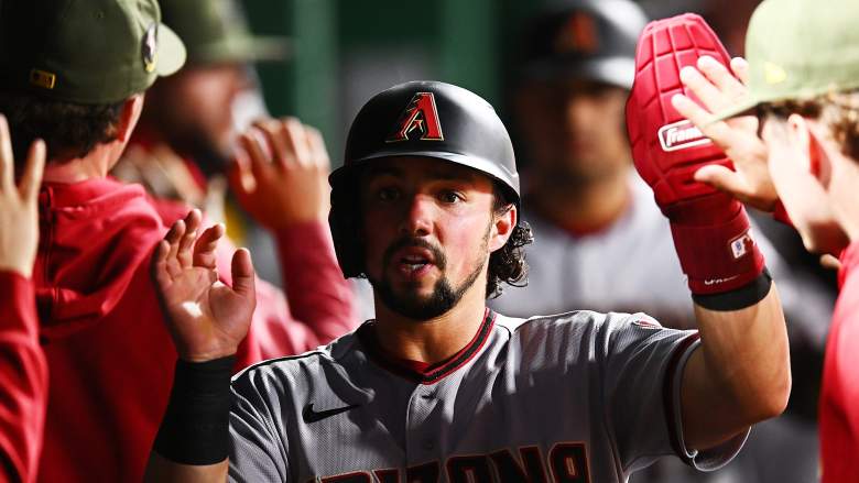 Arizona Diamondbacks outfielder Dominic Fletcher celebrates in the dugout after scoring against the Pittsburgh Pirates at PNC Park.