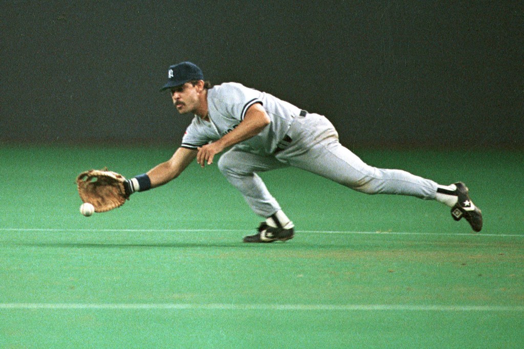 Don Mattingly, a baseball infielder, snags a grounder.