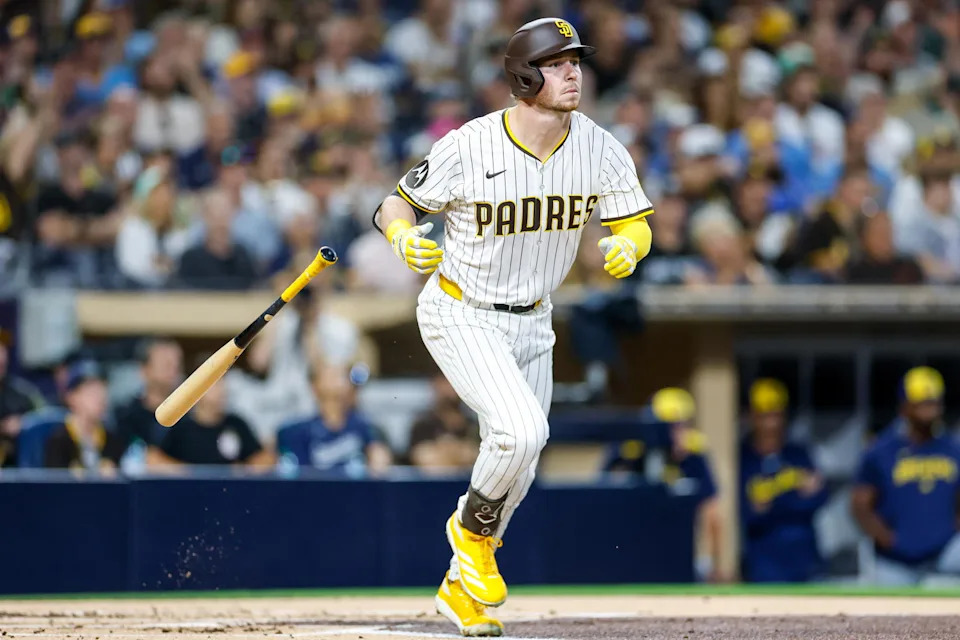 Sep 23, 2025; San Diego, California, USA; San Diego Padres first baseman Ryan O'Hearn (32) hits a grand slam during the first inning against the Milwaukee Brewers at Petco Park. Mandatory Credit: David Frerker-Imagn Images