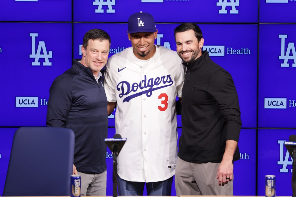 Edwin Diaz poses with Dodgers GM Brandon Gomes (right) and President of Baseball Operations Andrew Friedman at his introductory Dodgers press conference.